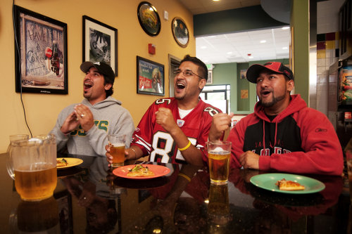 Three guys cheering