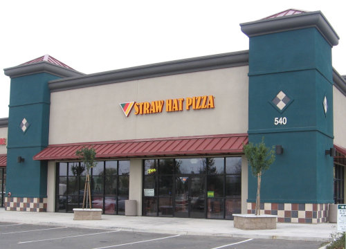 A modern Straw Hat Pizza in Yuba, CA, contrasting with the historical photos by being in color