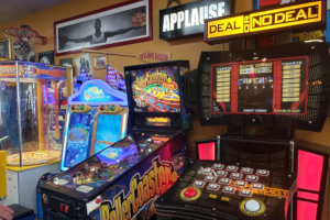 Arcade area with a pinball machine, Deal or No Deal game among other games
